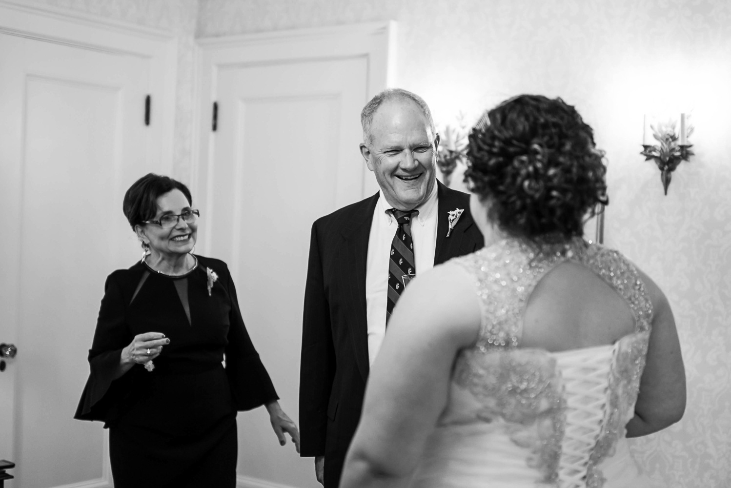dad seeing daughter in her dress on her wedding day at the St Paul College Club