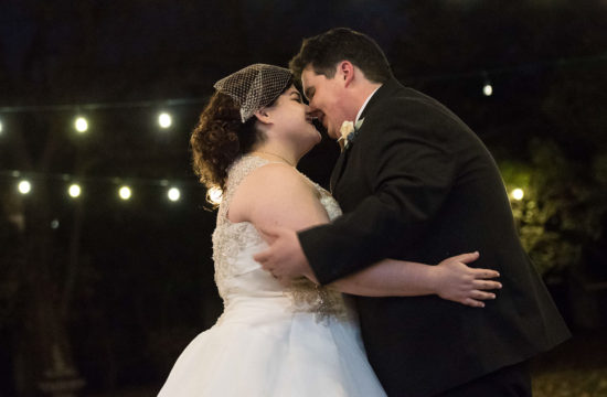 bride and groom touching foreheads at the St Paul College Club