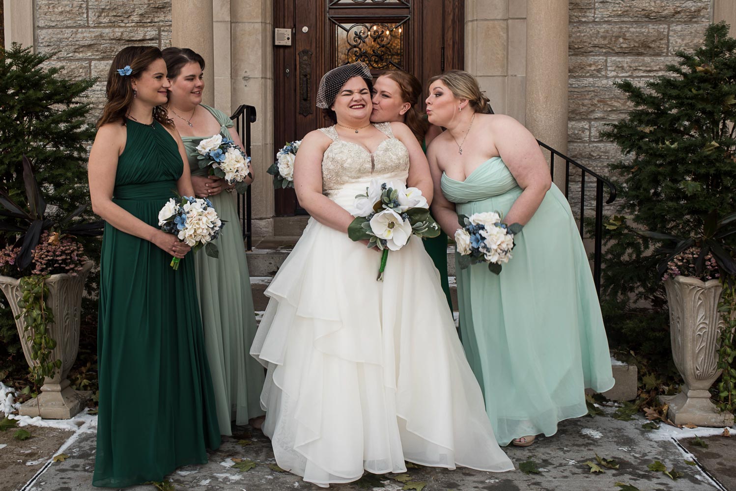 bride with her bridesmaids in green dresses at the St Paul College Club