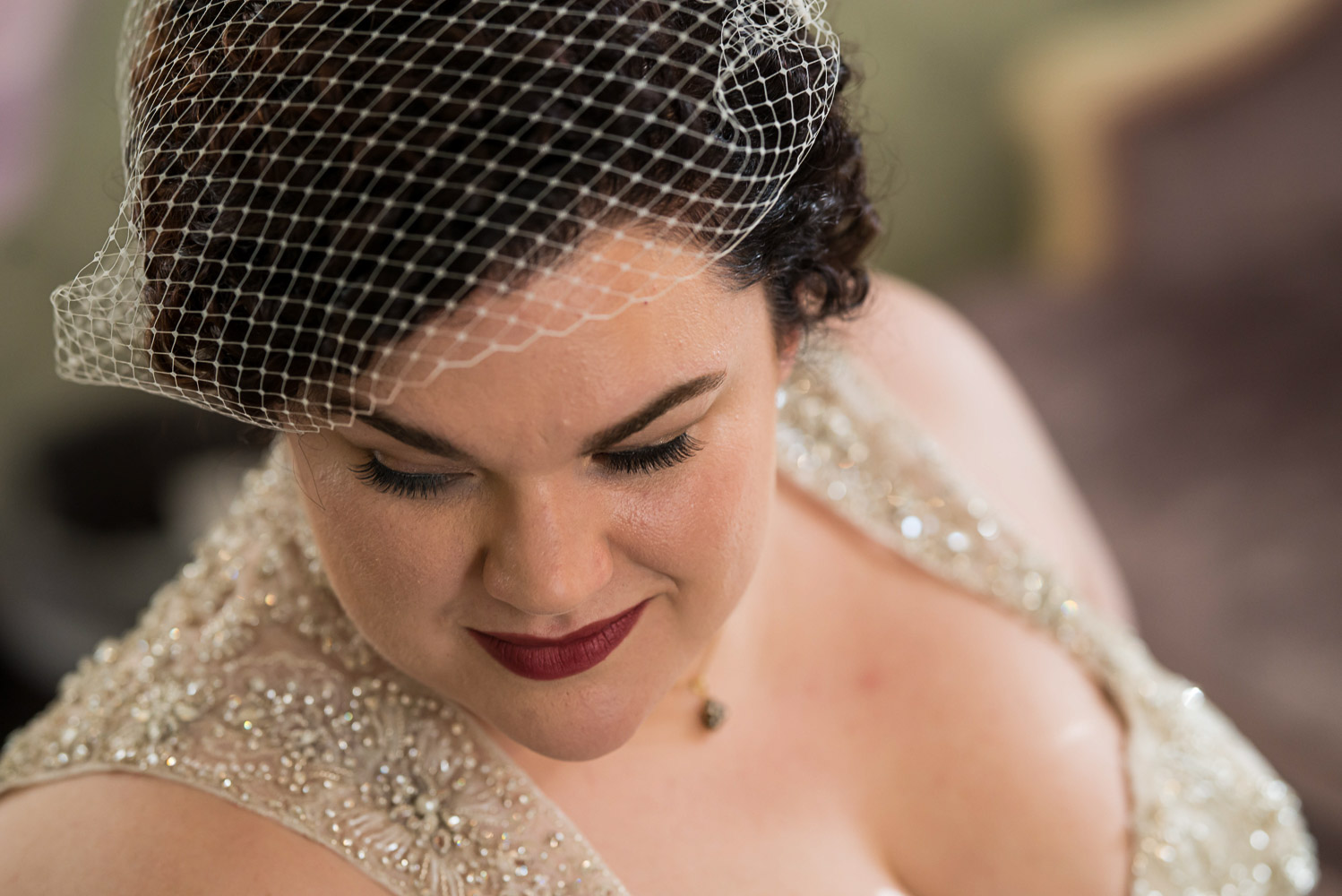 bride with red lipstick wearing a birdcage veil at the St Paul College Club