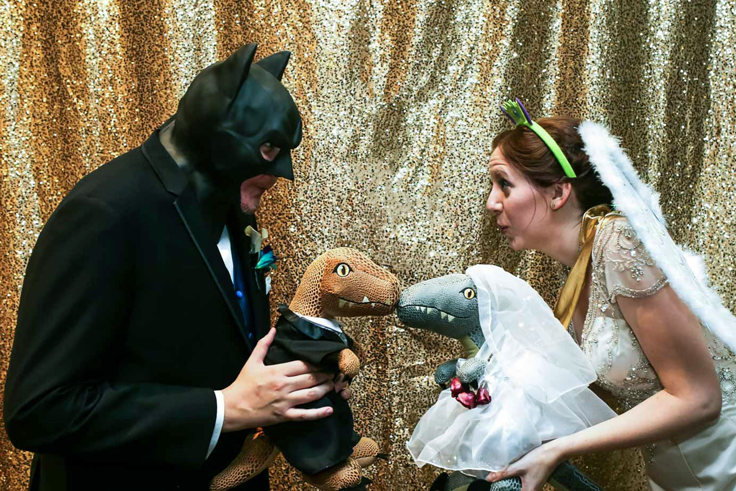 bride and groom playing with dinosaurs at the Science Museum