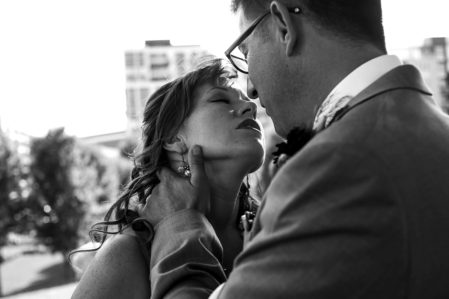 bride and groom sharing their first kiss after the ceremony at Gold Medal Park in Minneapolis