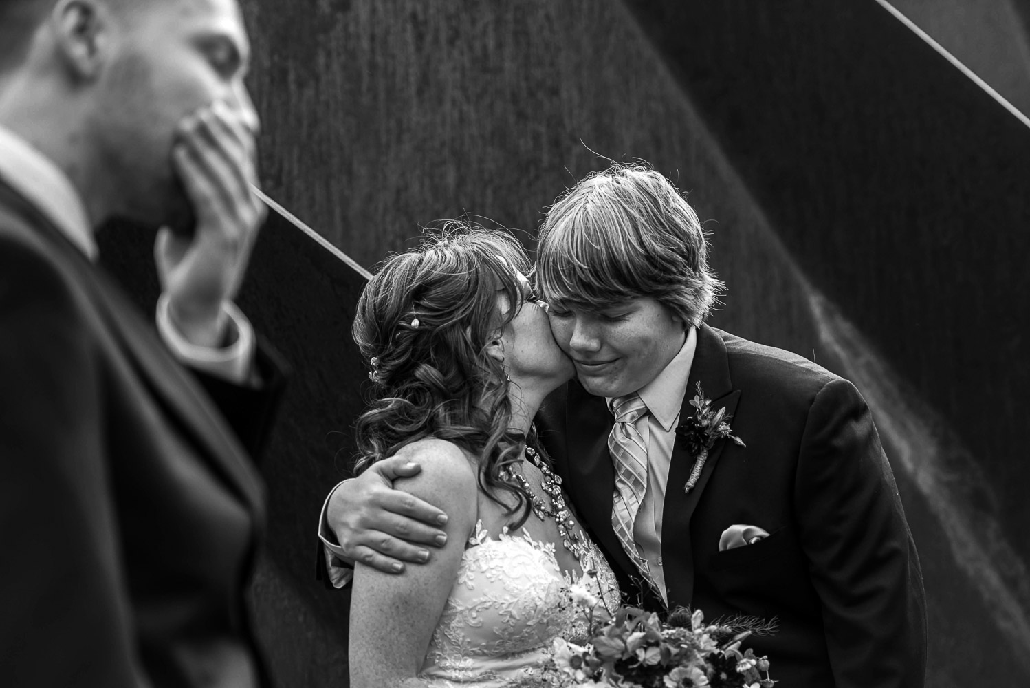 bride kissing her son at The Guthrie in Minneapolis