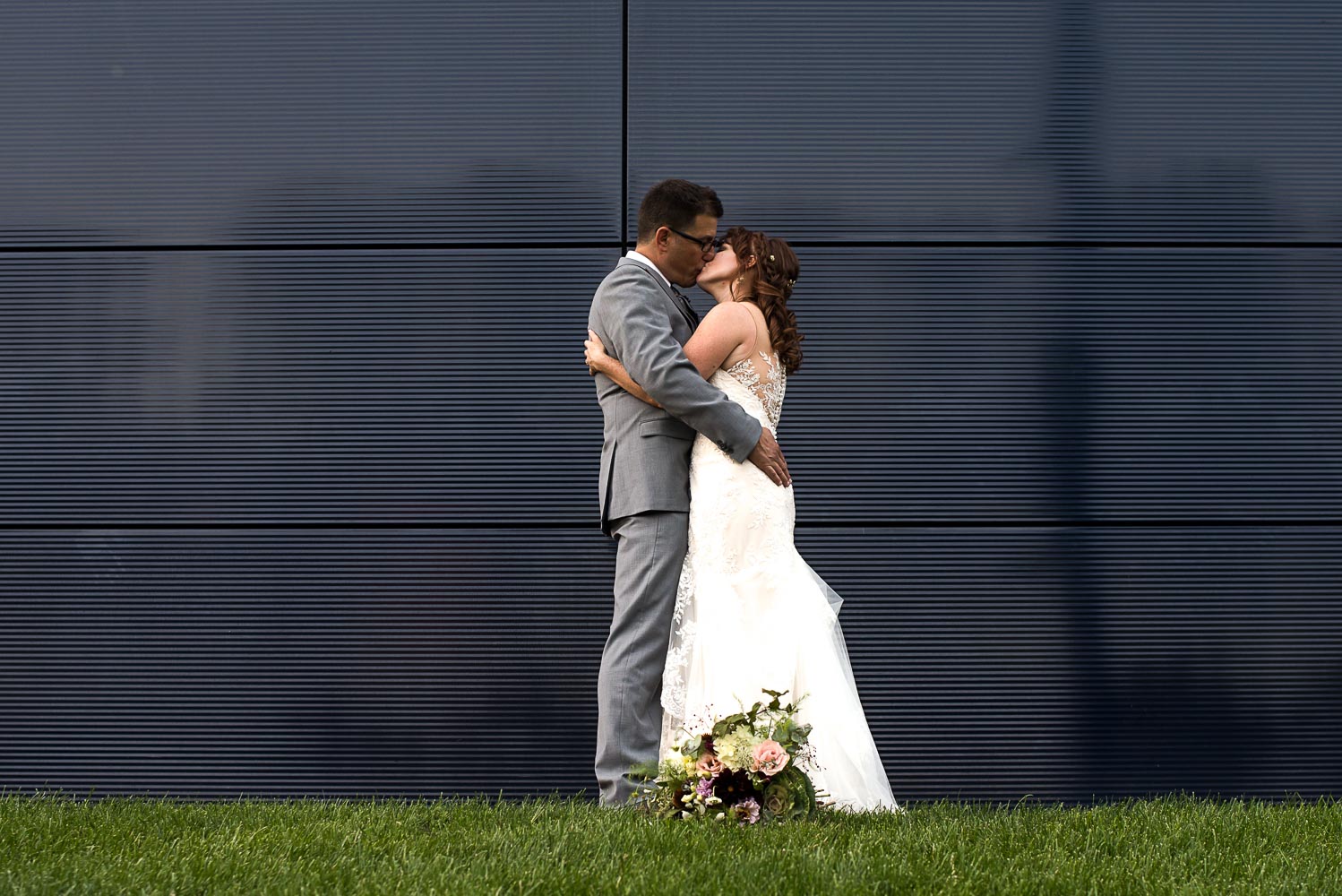 bride and groom outside the Guthrie theater in Minneapolis