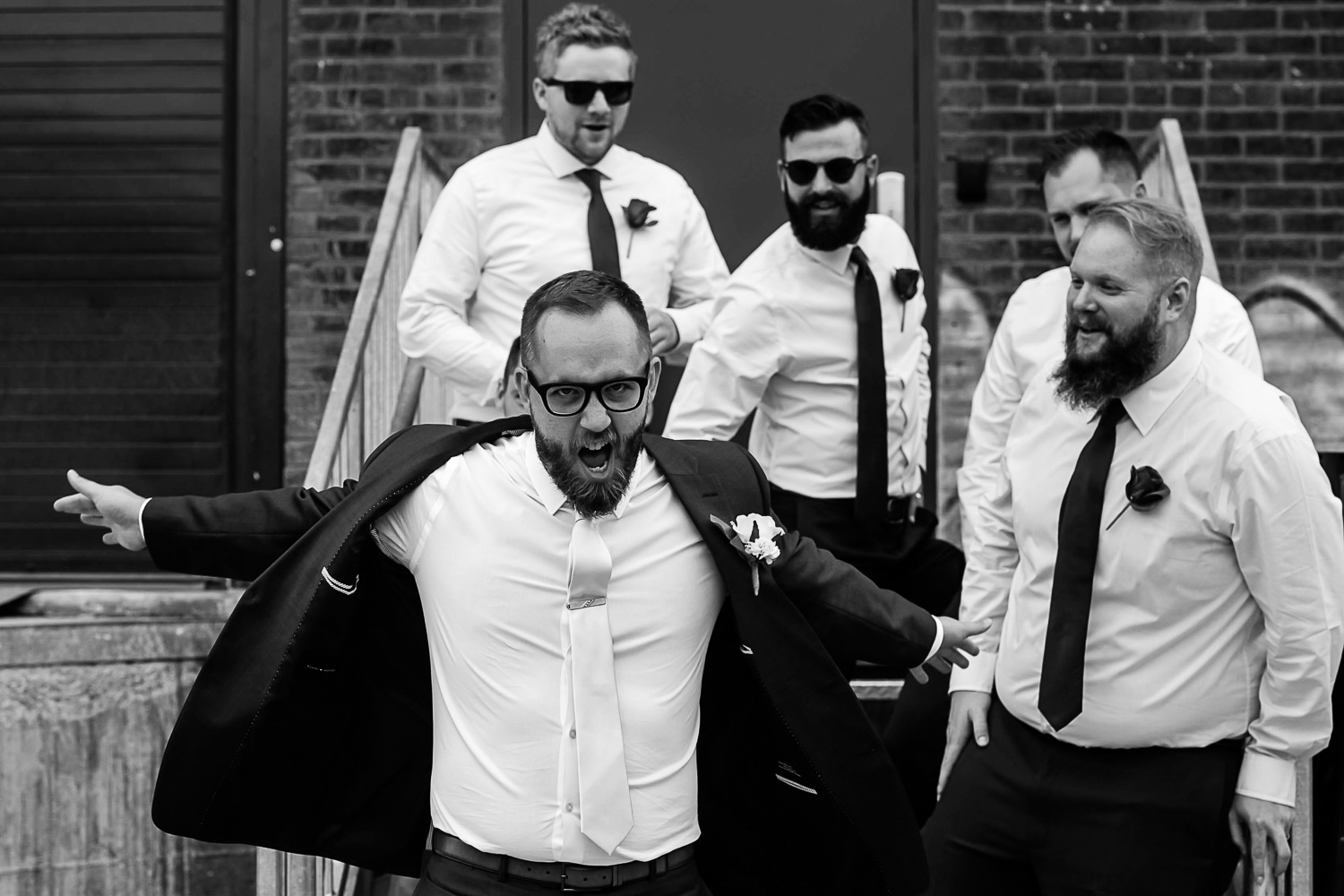 groom and groomsmen portraits in the industrial area of Minneapolis