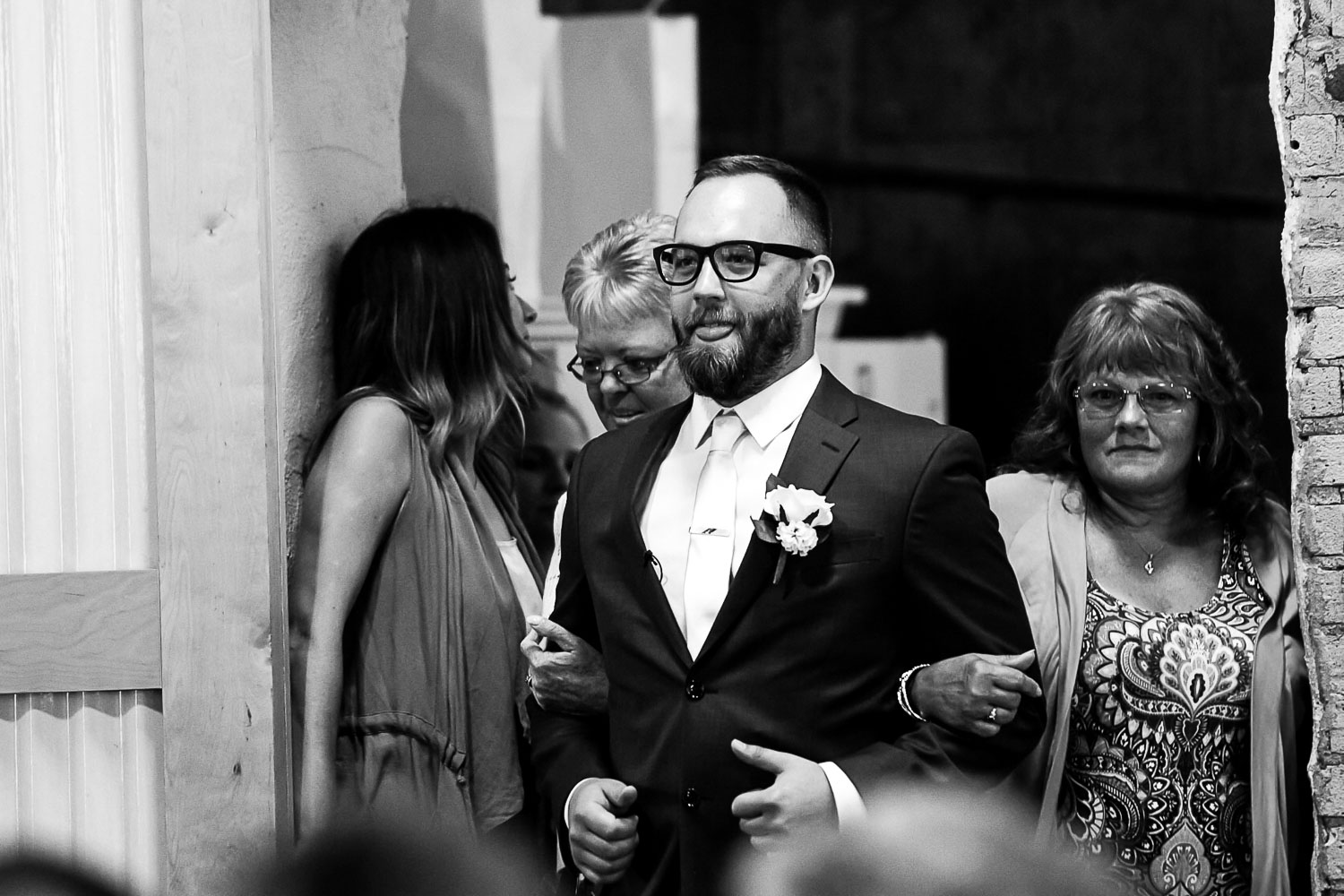 groom walking down the aisle of for his wedding ceremony