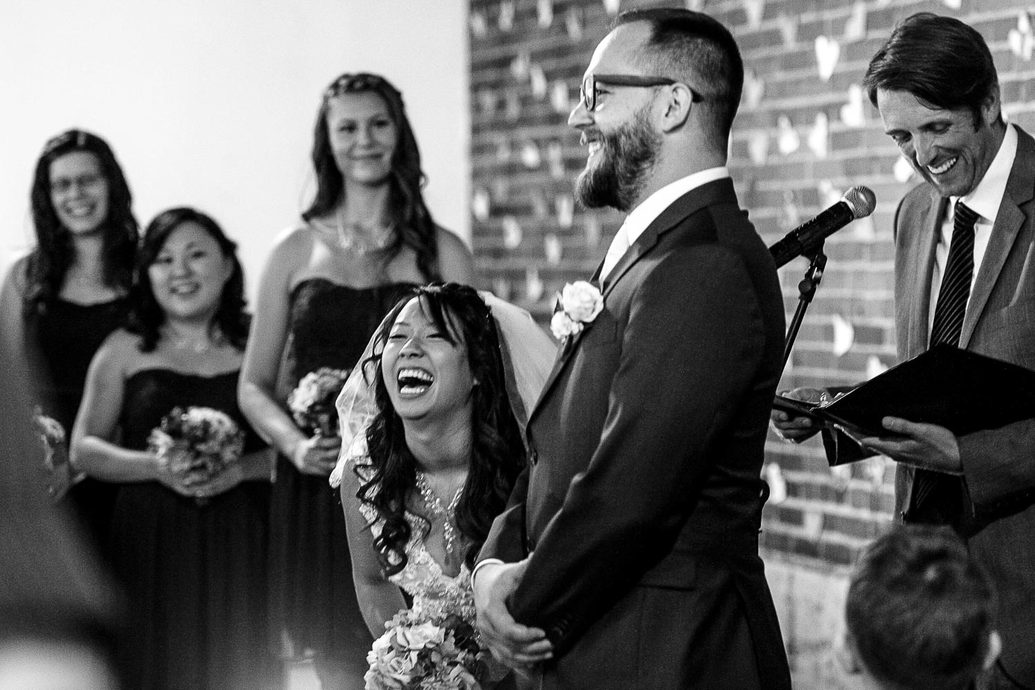 bride laughing at the groom during their wedding ceremony at Neu Neu