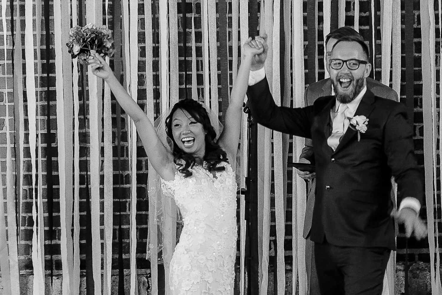 bride and groom celebrating after their wedding ceremony