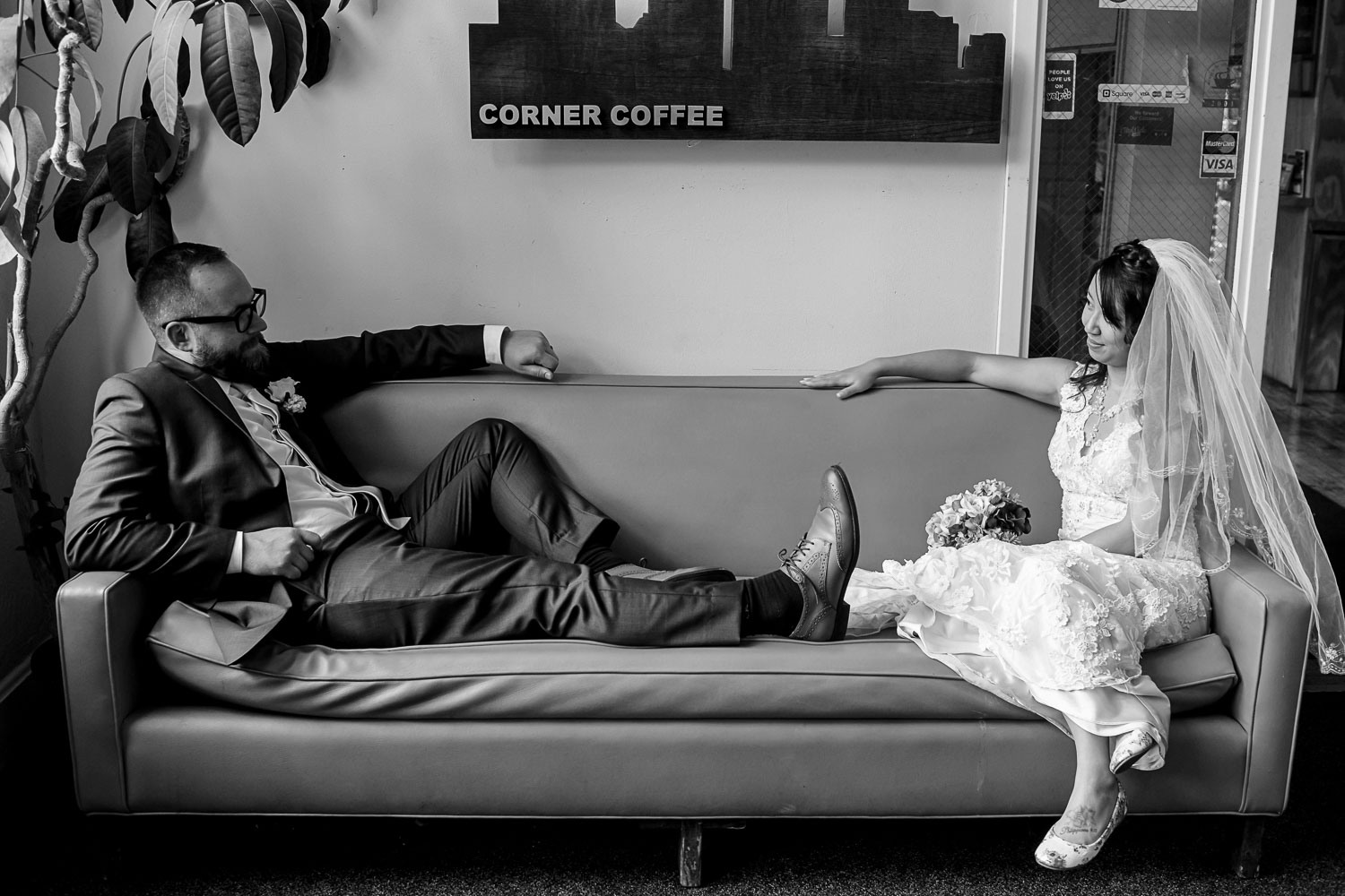 bride and groom sitting on a couch at Neu Neu in Minneapolis