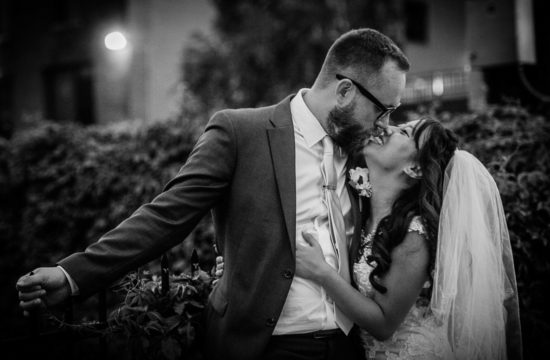 bride and groom kissing outside of their Minneapolis North Loop venue