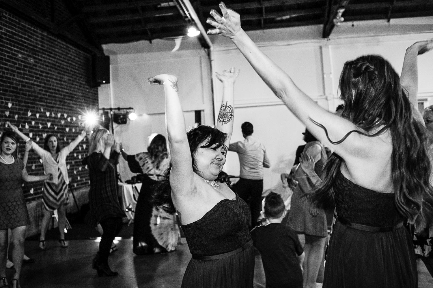 wedding guests dancing at the reception in the North Loop in Minneapolis