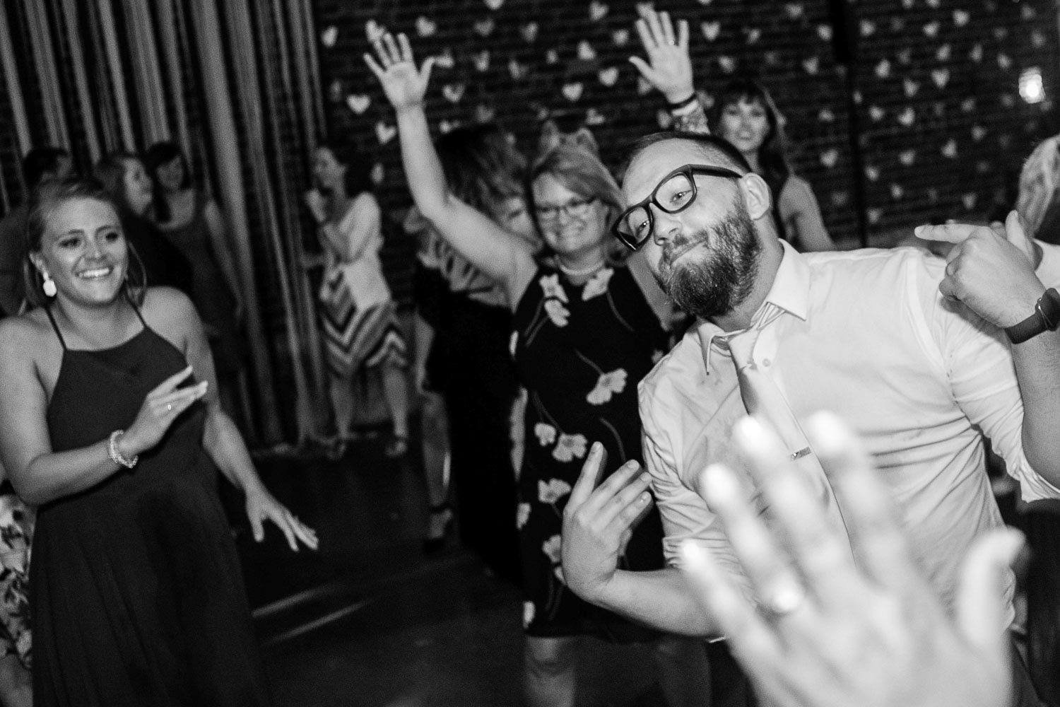 groom dancing with the guests at the wedding in Minneapolis