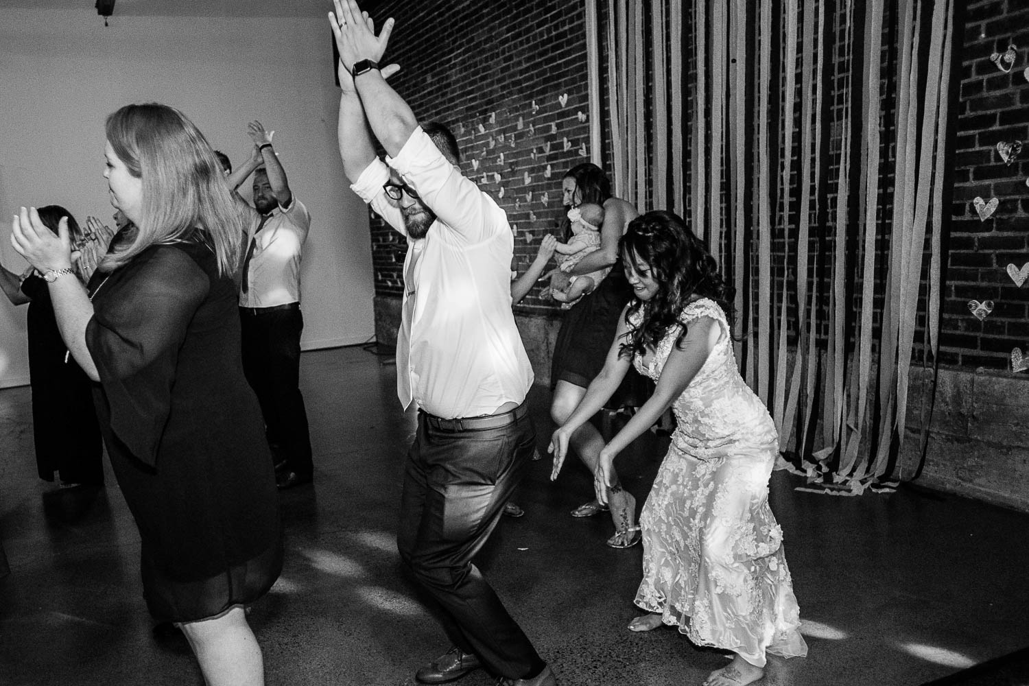 bride and groom dancing with their wedding guests in Minneapolis