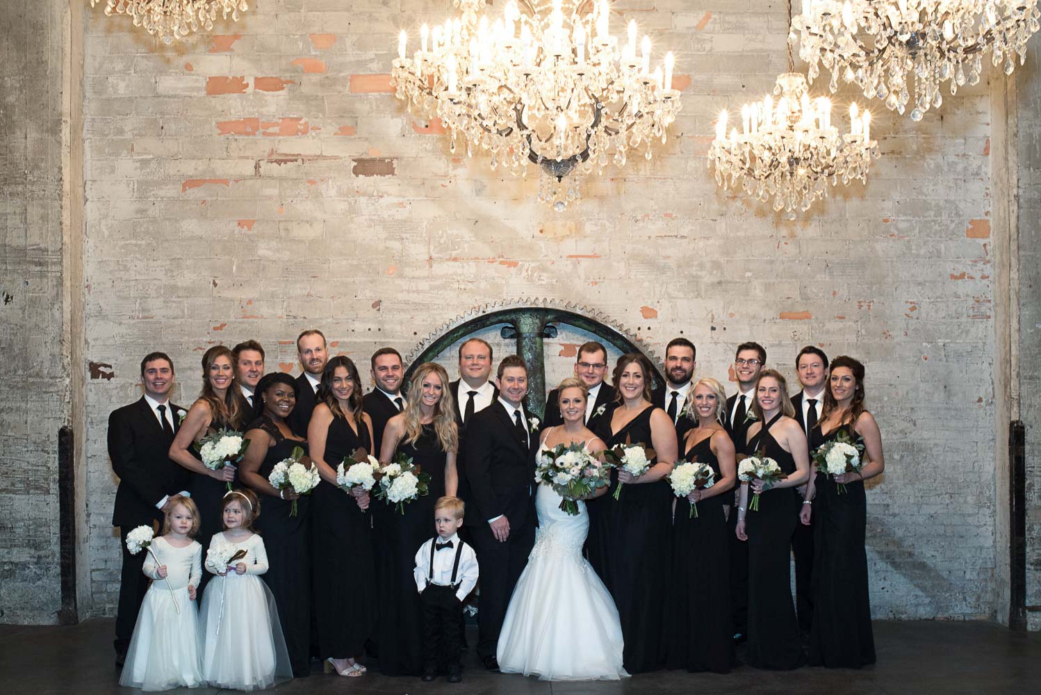 bride and groom with their wedding party portrait at Aria in Minnesota