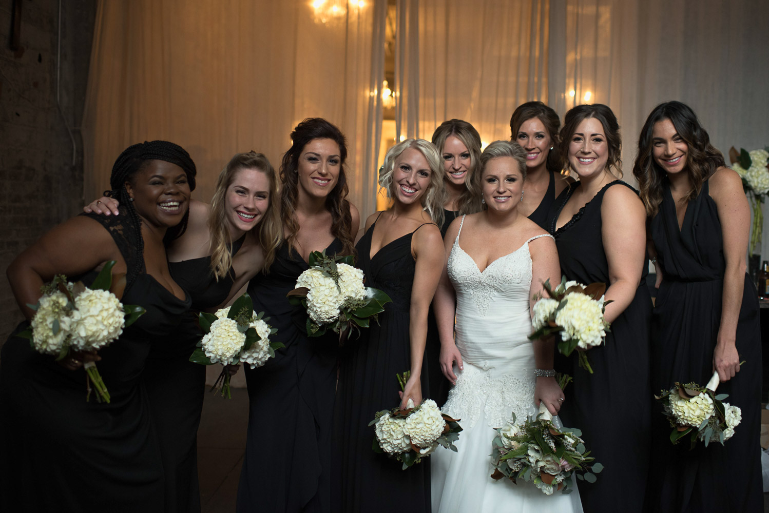 bride and bridesmaids portraits with their flowers at Aria Minneapolis