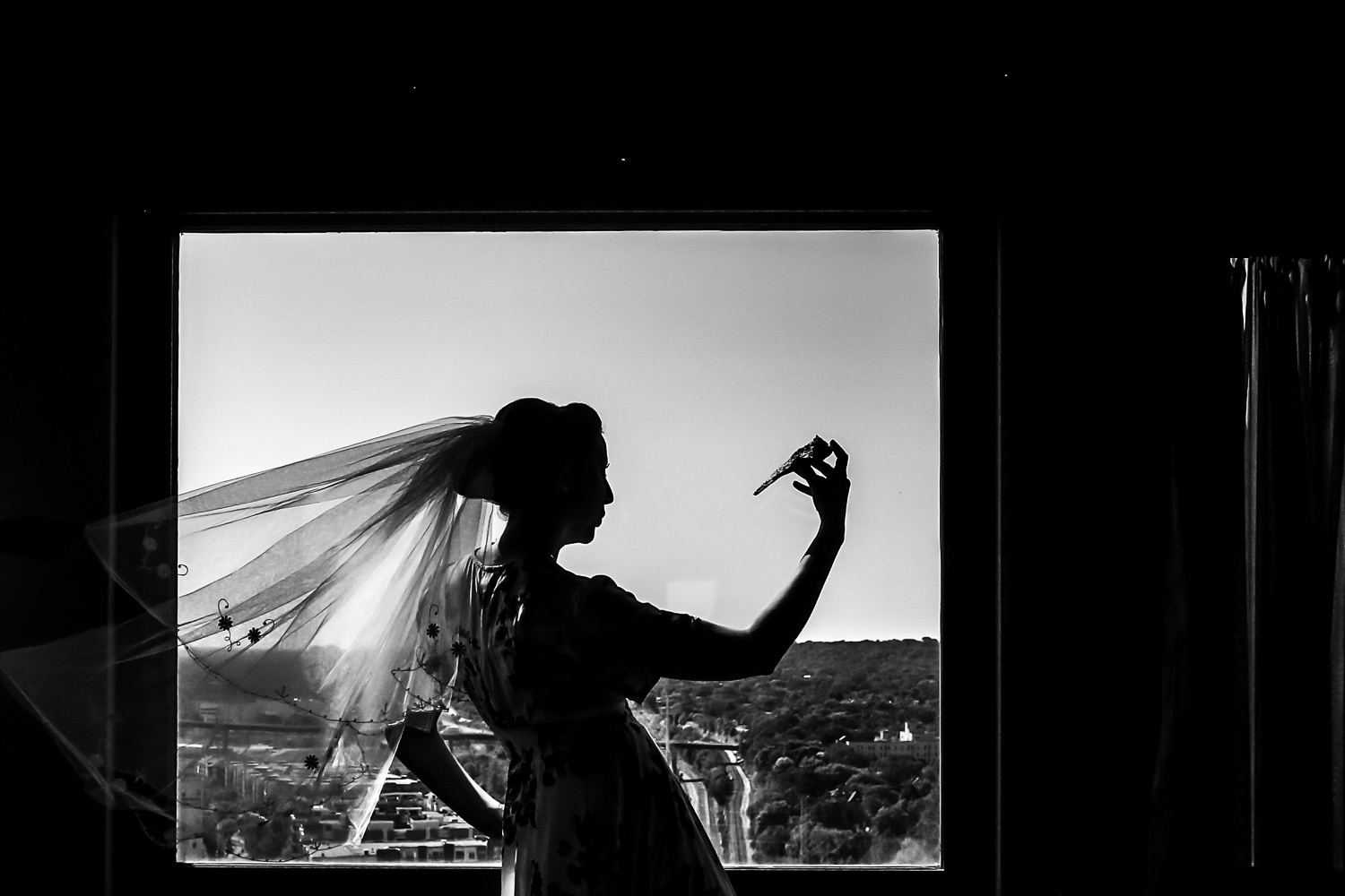 bride silhouetted her veil in the window at the St Paul hotel