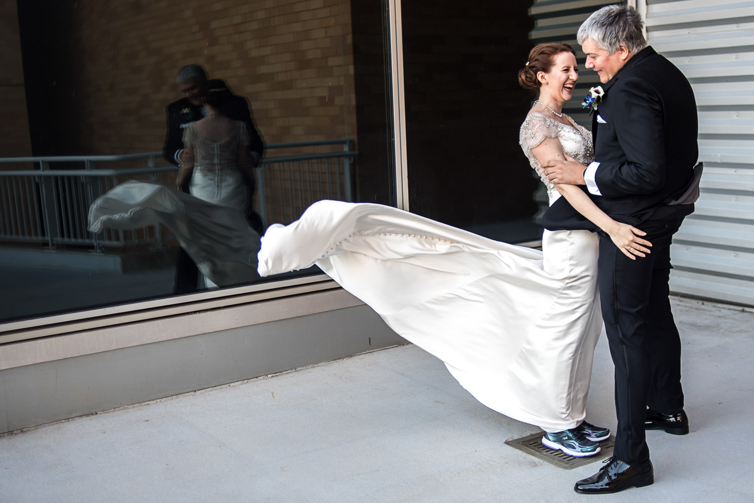 bride and groom on the balcony at the Science Museum in Minnesota