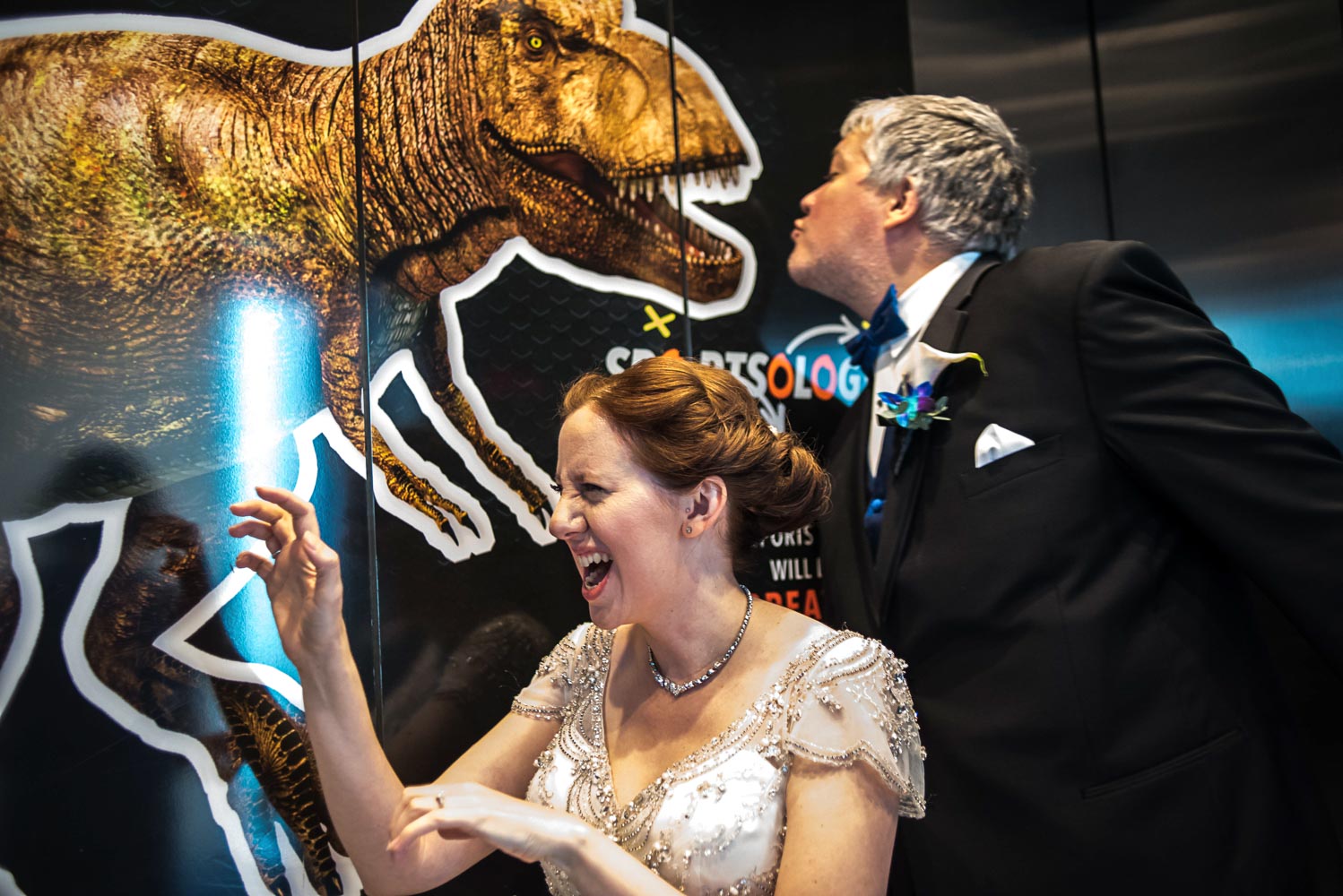bride and groom at the elevator in the Science Museum