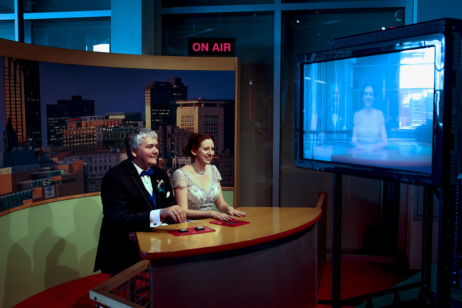 bride and groom playing at the exhibits of the St Paul Science museum