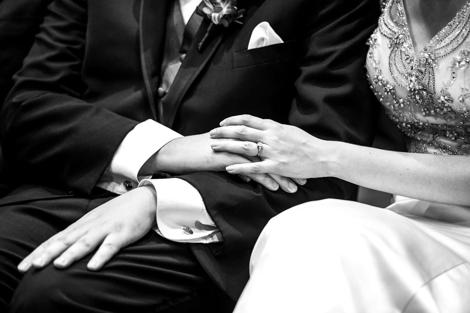 bride and groom holding hands during their wedding ceremony at the Science Museum in St Paul