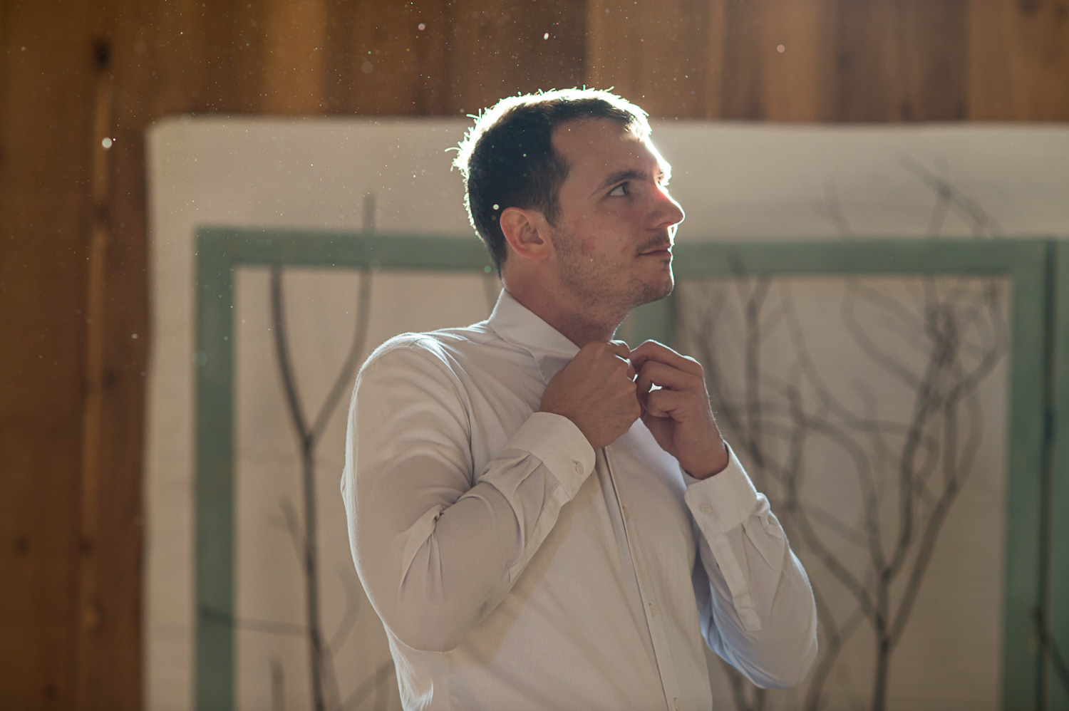 groom getting ready for his winter wedding