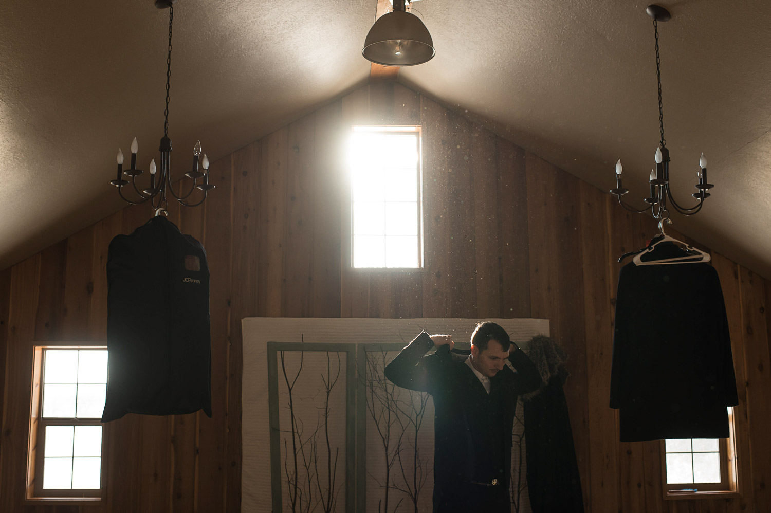 groom getting ready for his winter wedding