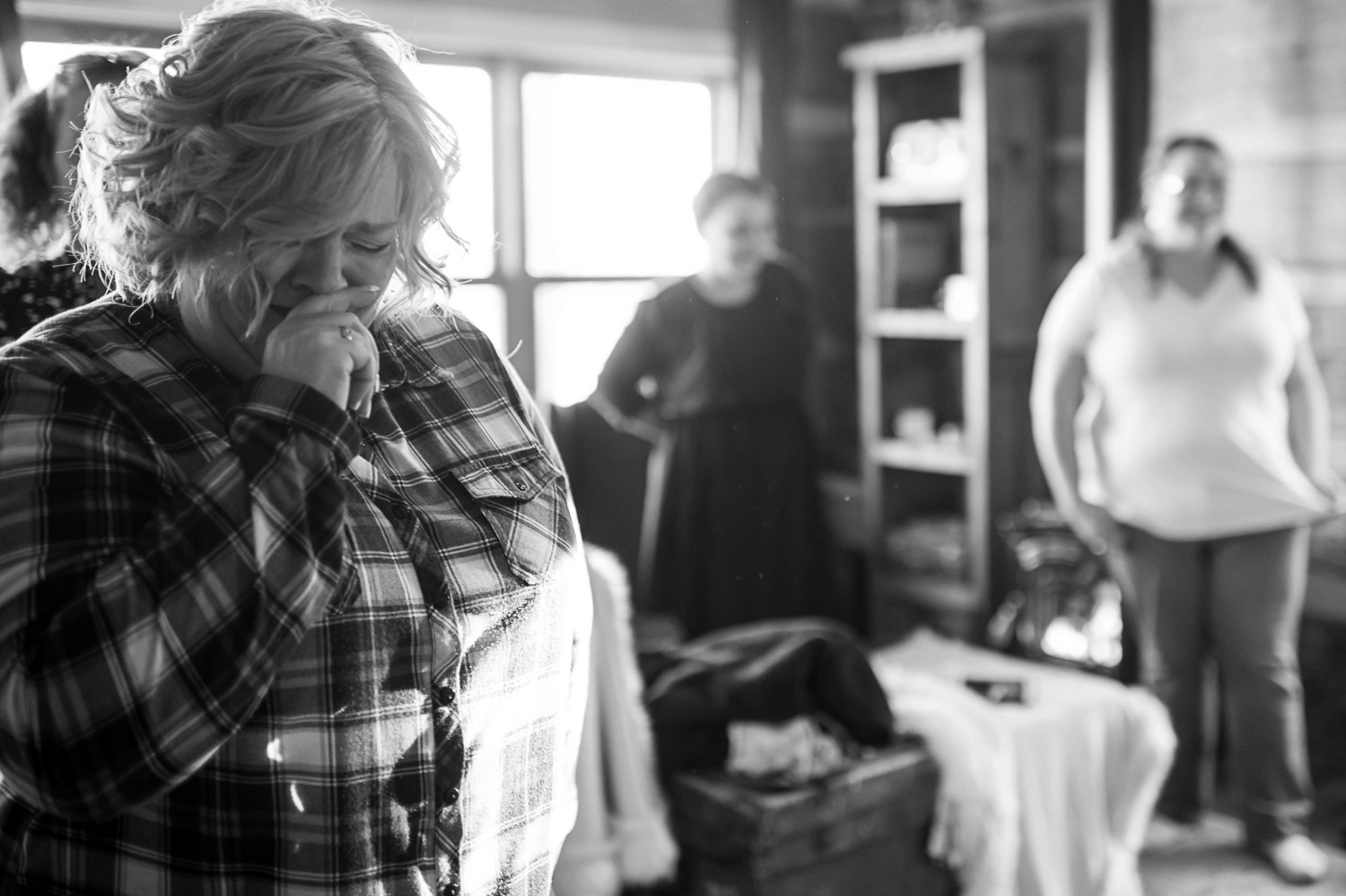 mom crying seeing her daughter in her wedding dress