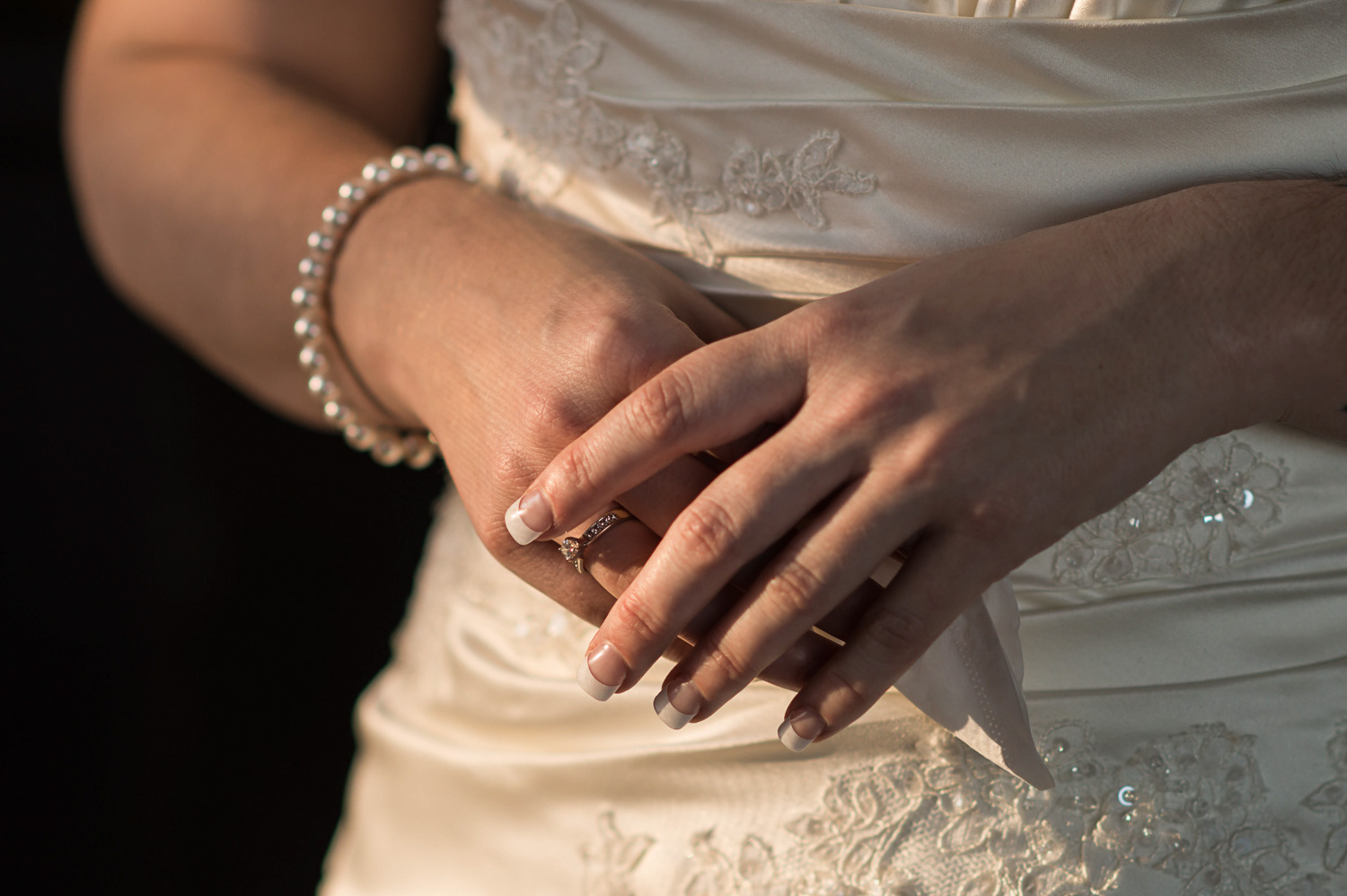 detail of bride's hands right before her winter wedding
