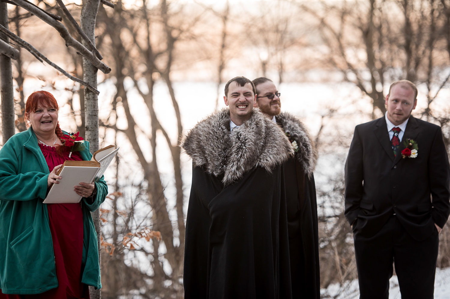 groom seeing her bride for the first time for their Minnesota winter wedding