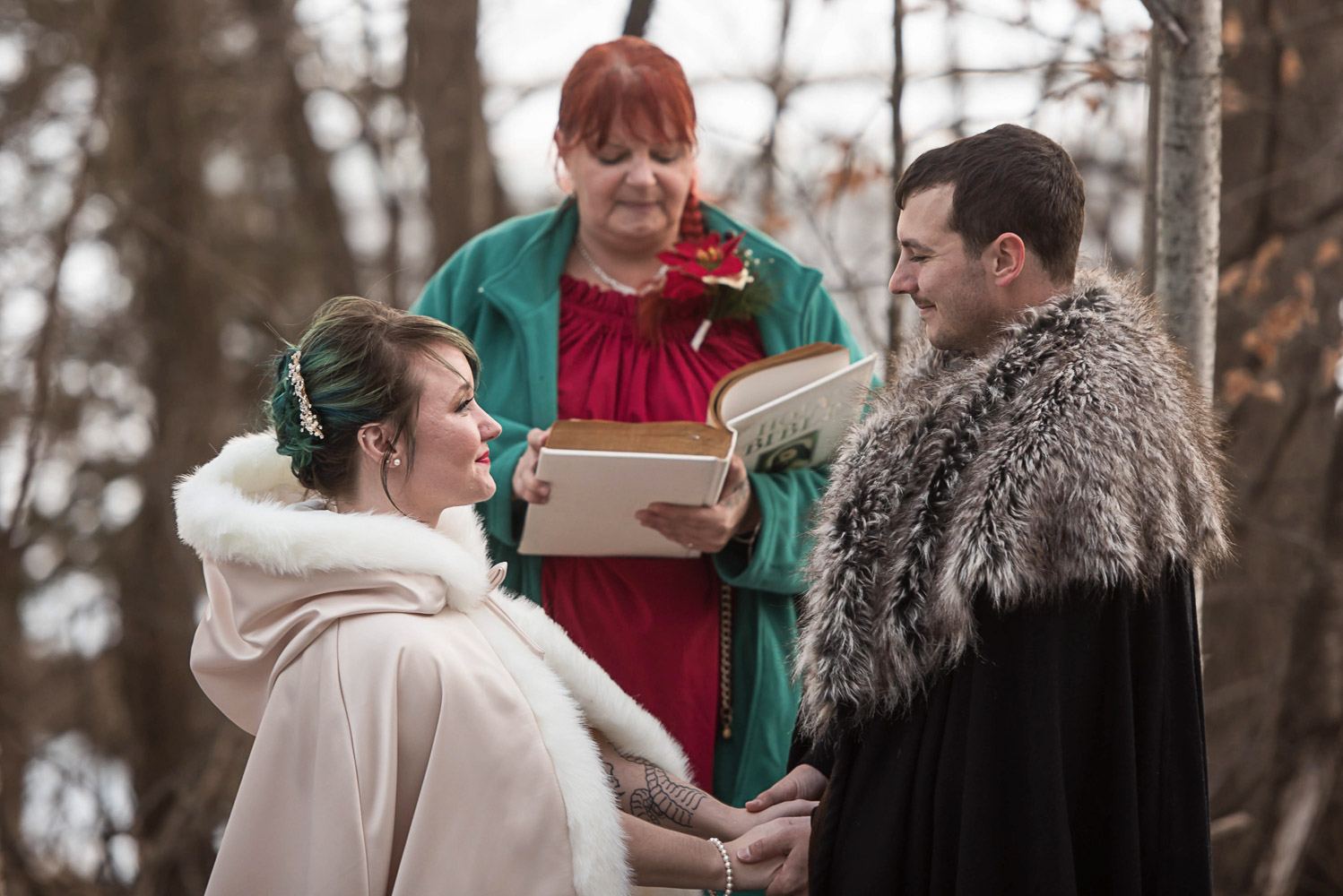 bride and groom saying their vows during their outdoor winter wedding in Minnesota