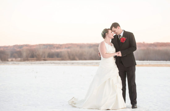 bride and groom in the snow Minnesota winter wedding