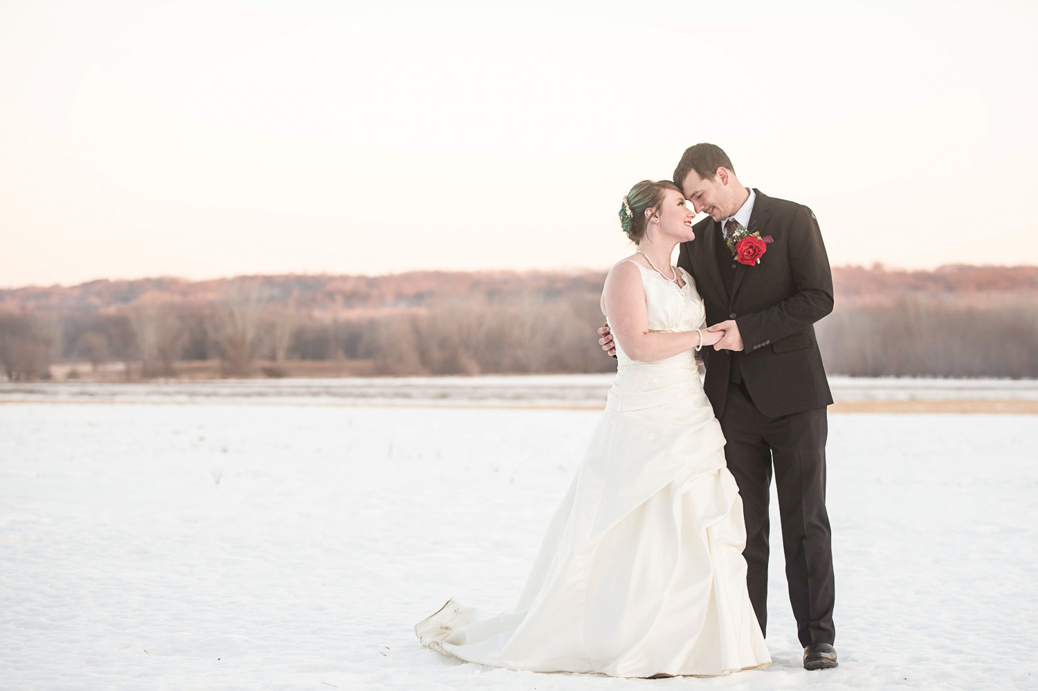 bride and groom in the snow Minnesota winter wedding