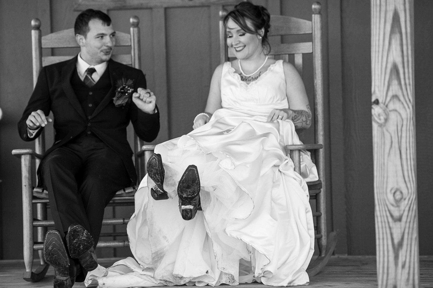 bride and groom sitting on a porch during their Minnesota winter wedding