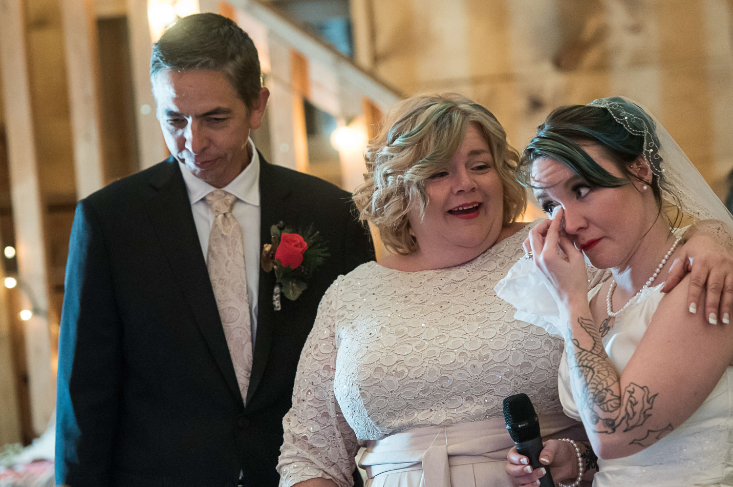 bride crying during speeches at her winter wedding in Minnesota