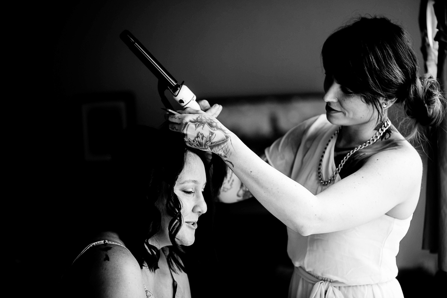 bride getting her hair done at home for her summer wedding in Minnesota