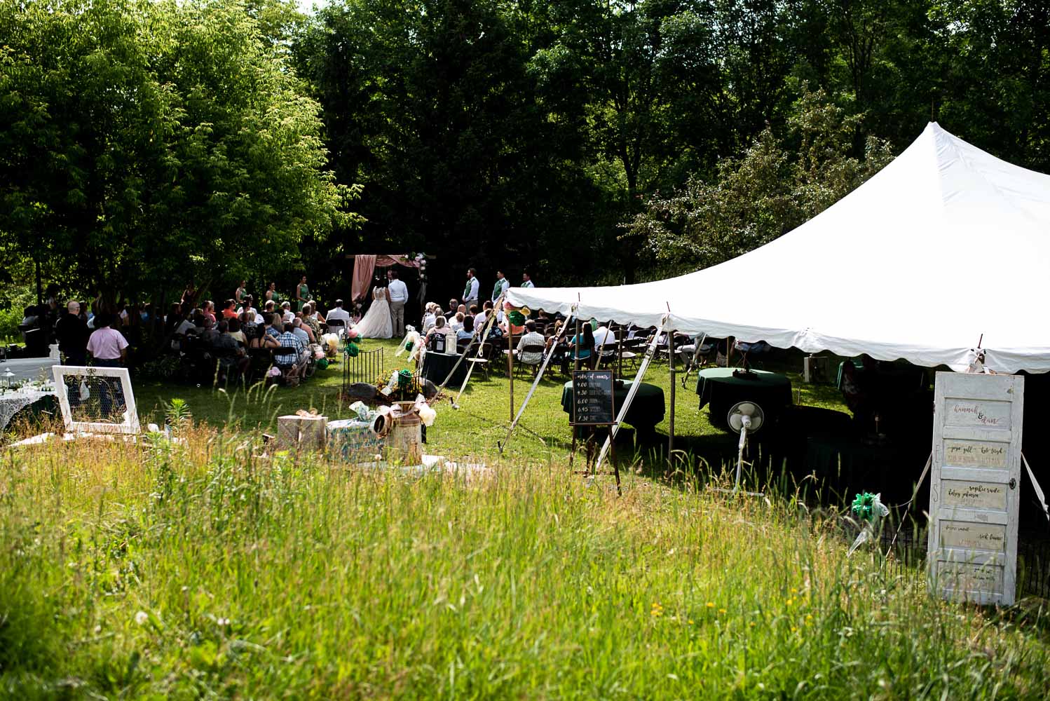 wedding ceremony and reception tent at the bride and groom's home