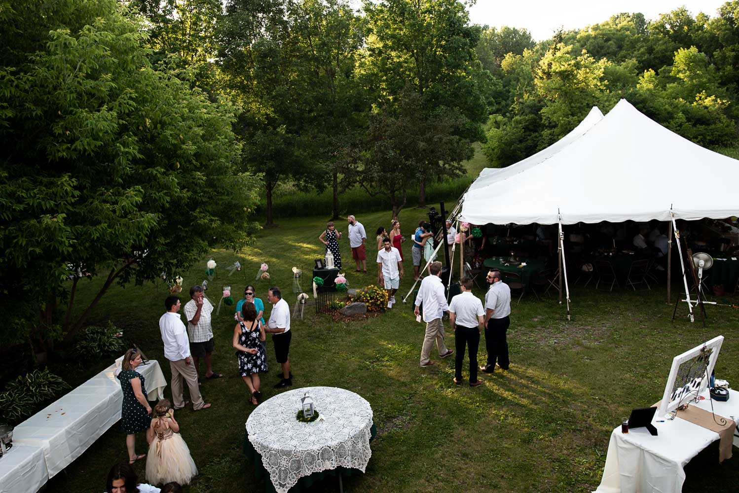 wedding guests hanging out with the bride and groom at their summer wedding in Minnesota