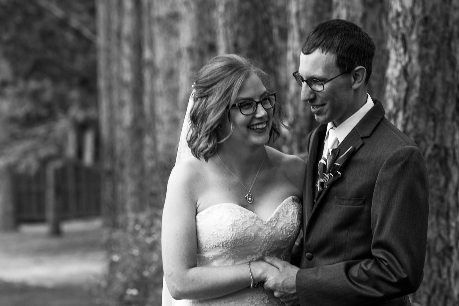 bride and groom holding hands before their wedding ceremony at Pine Peaks Lodge in Minnesota