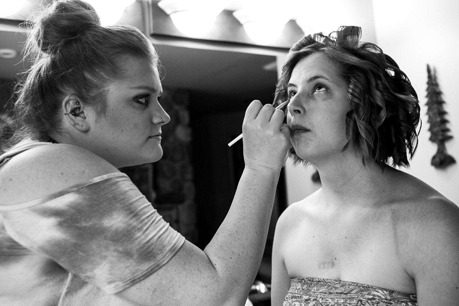 bride getting makeup on at the Pine Peaks Lodge in Northern Minnesota