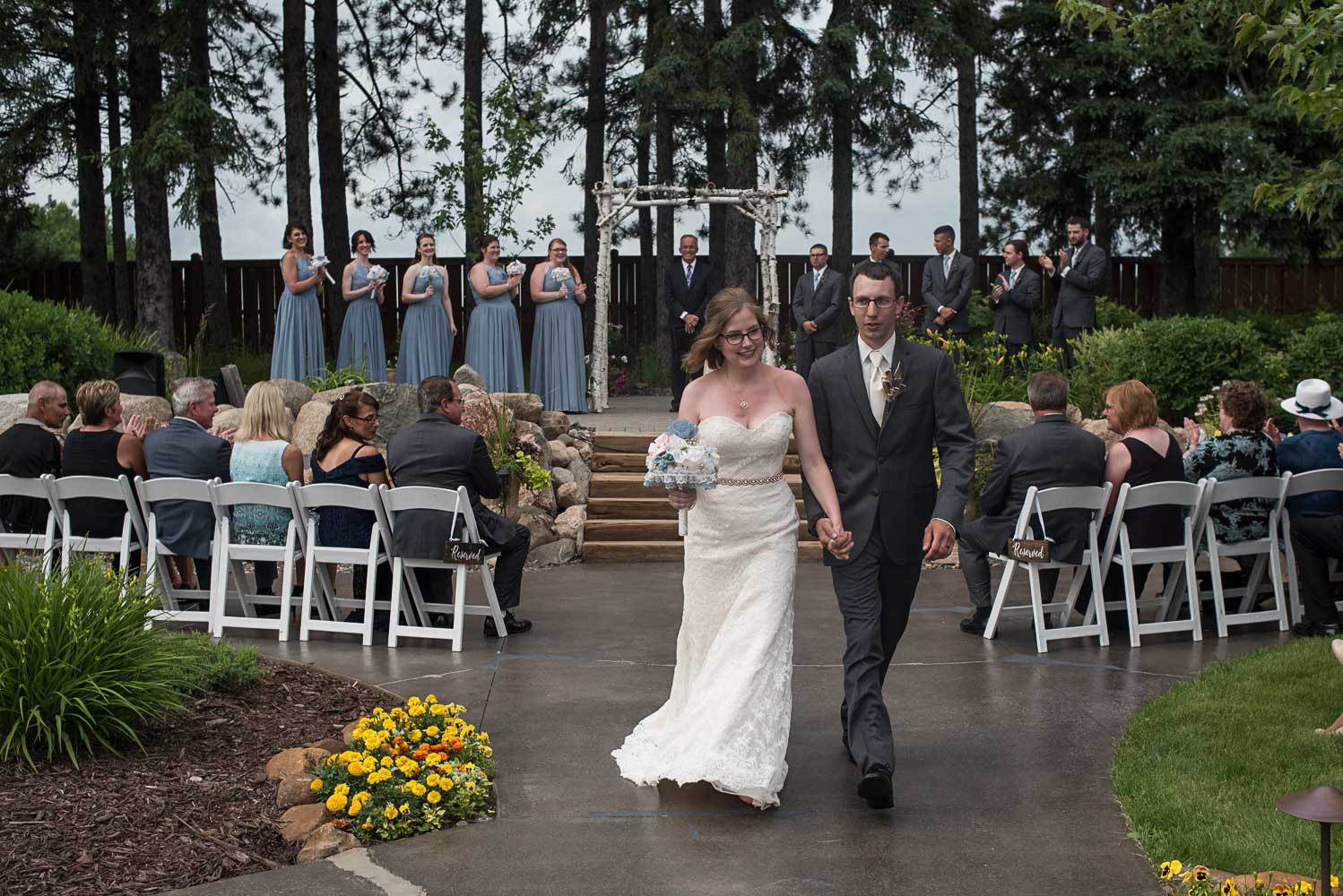 bride and groom walking down the aisle after their ceremony at Pine Peaks Wedding and Event Center up North Minnesota