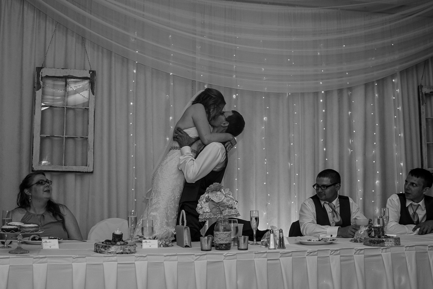 bride and groom kissing during their wedding reception at Pine Peaks Wedding and Event Center up north Minnesota