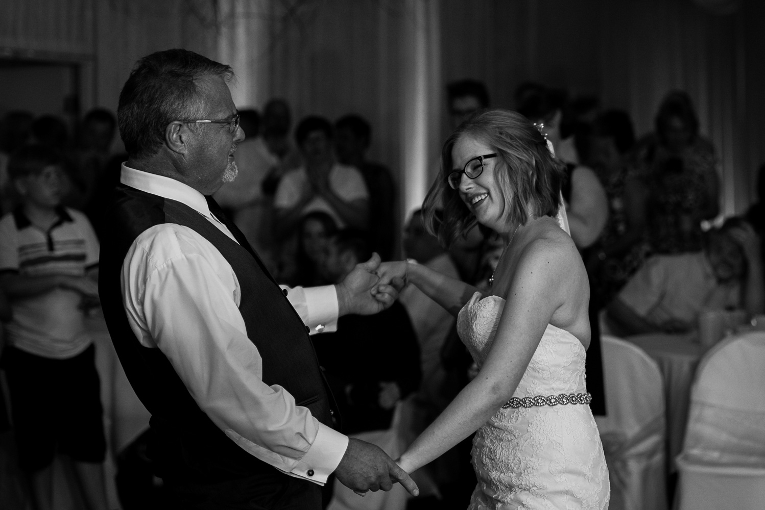bride dancing with her father during the wedding reception at Pine Peaks Wedding and Event Center in Minnesota
