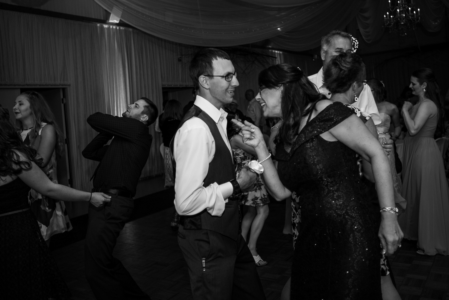 groom dancing with guests at his reception at Pine Peaks Wedding and Event Center in Northern Minnesota