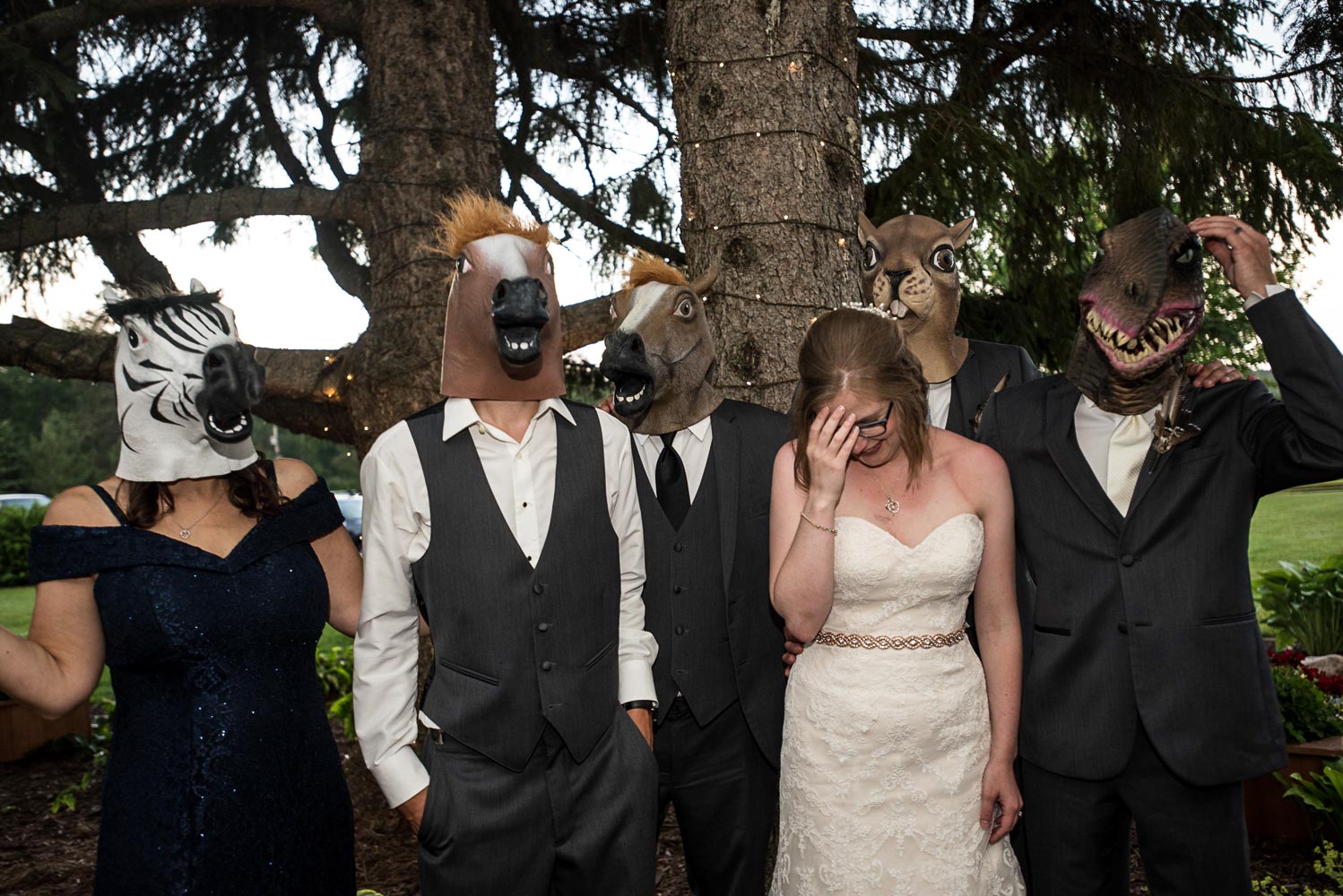 groom's family wearing animal masks at Pine Peaks Lodge in Minnesota