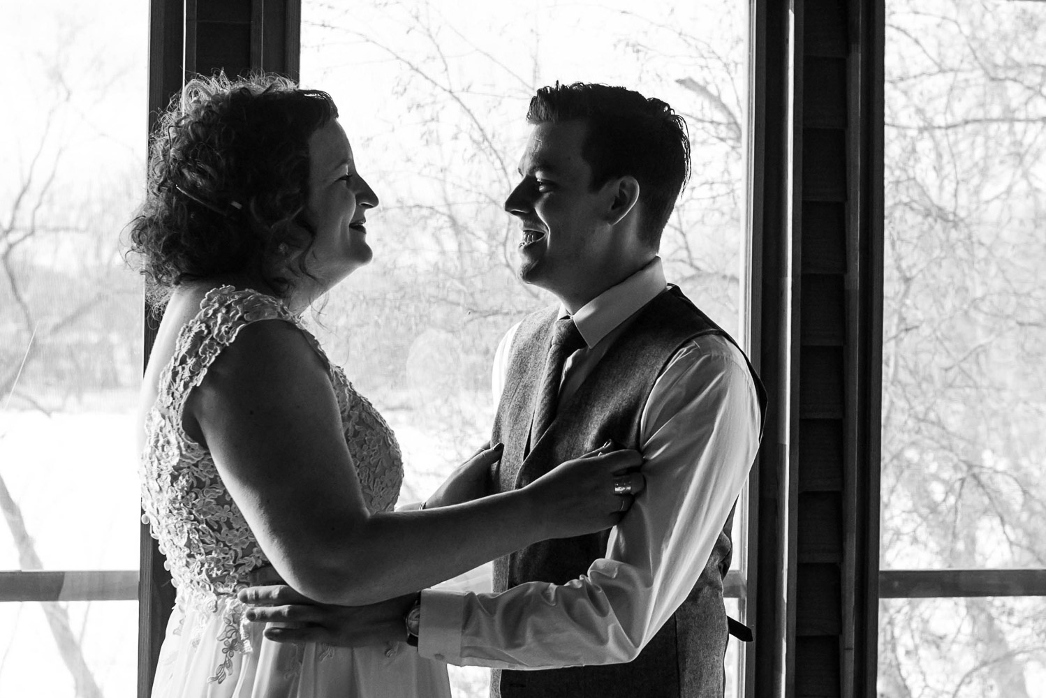 bride and groom hugging after seeing each other for the first time on their wedding day
