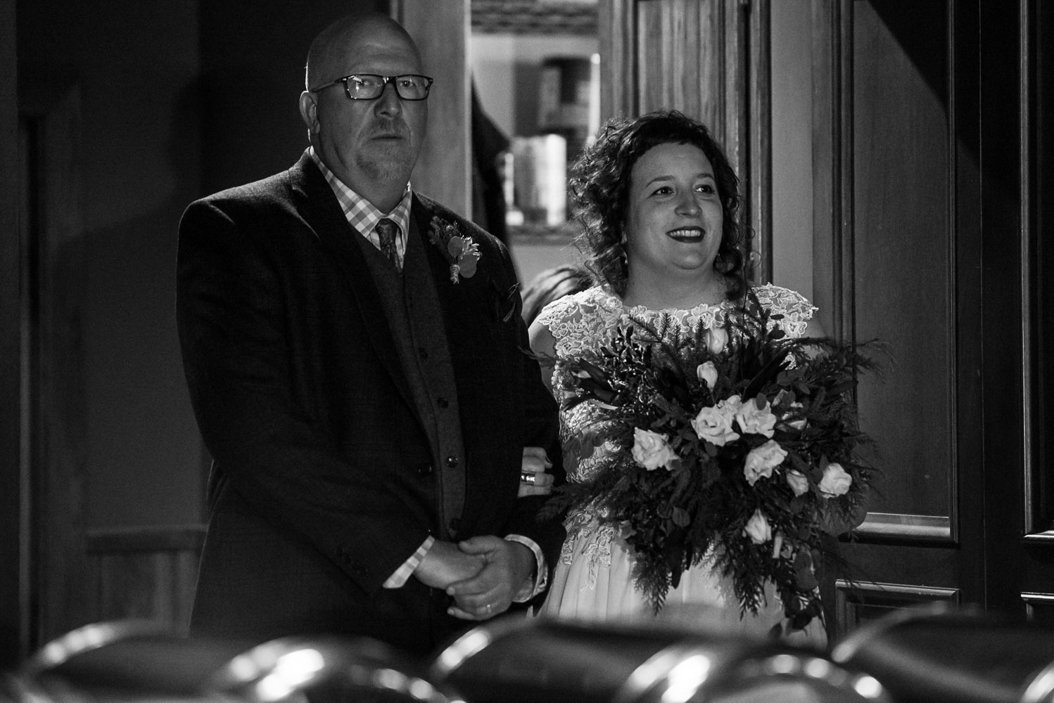 bride and her father waiting to walk to the groom for the wedding ceremony at Turtle's 1890 Social Centre