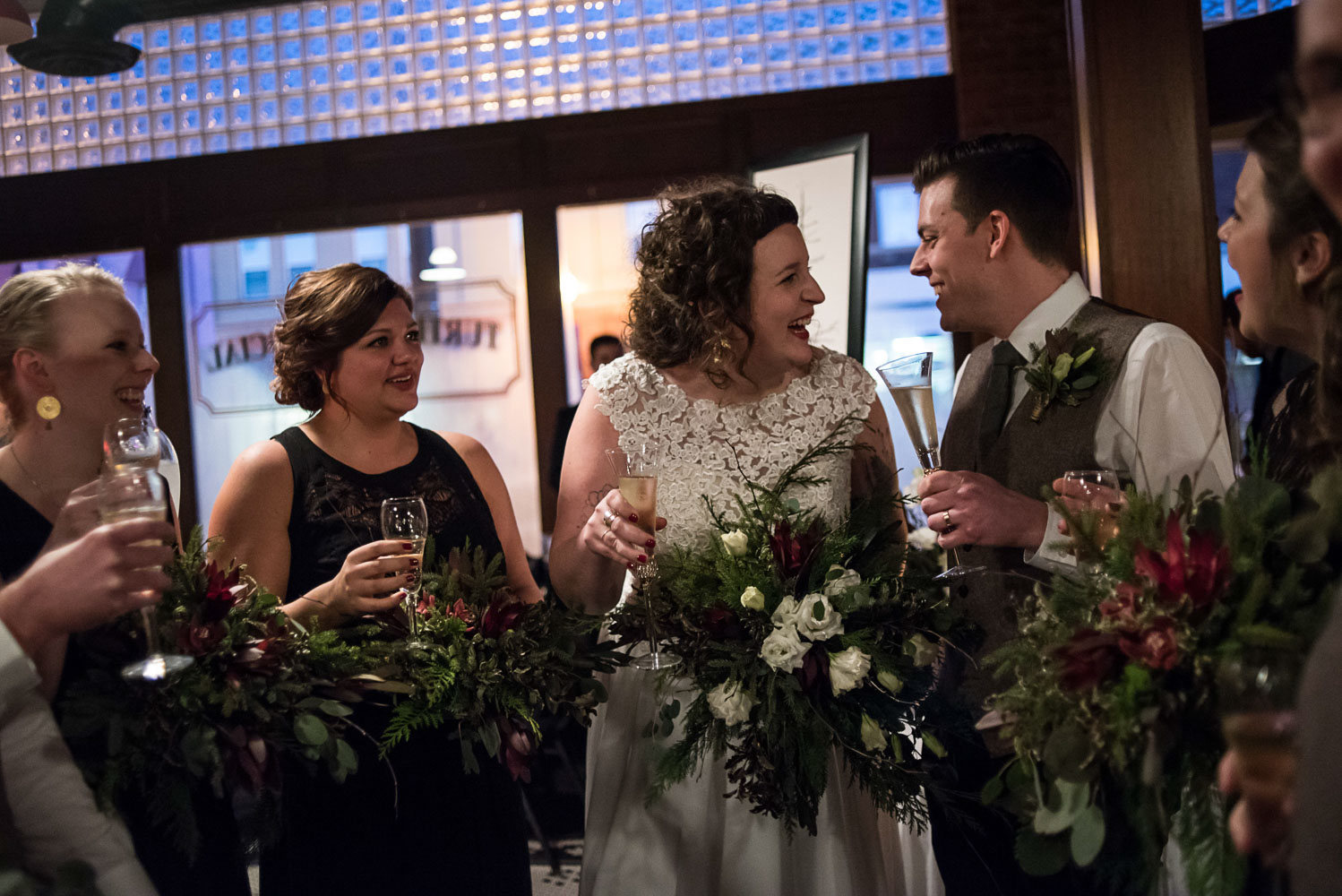 bride and groom toasting with their wedding party at Turtle's in Minnesota