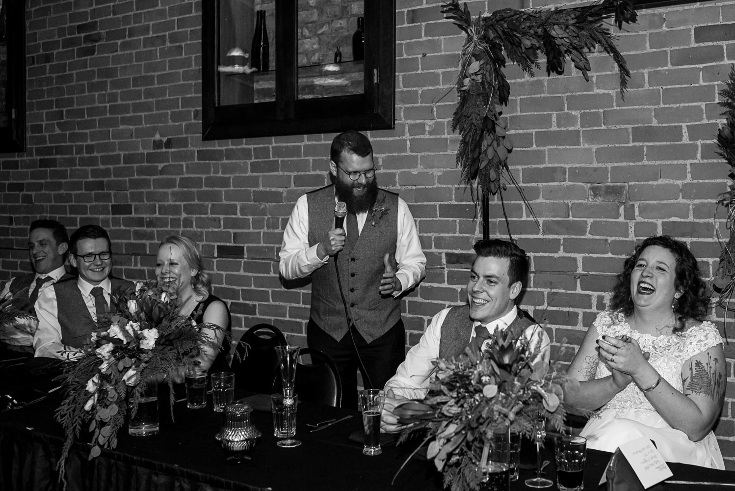 best man giving a speech during the reception at Turtle's in Minnesota