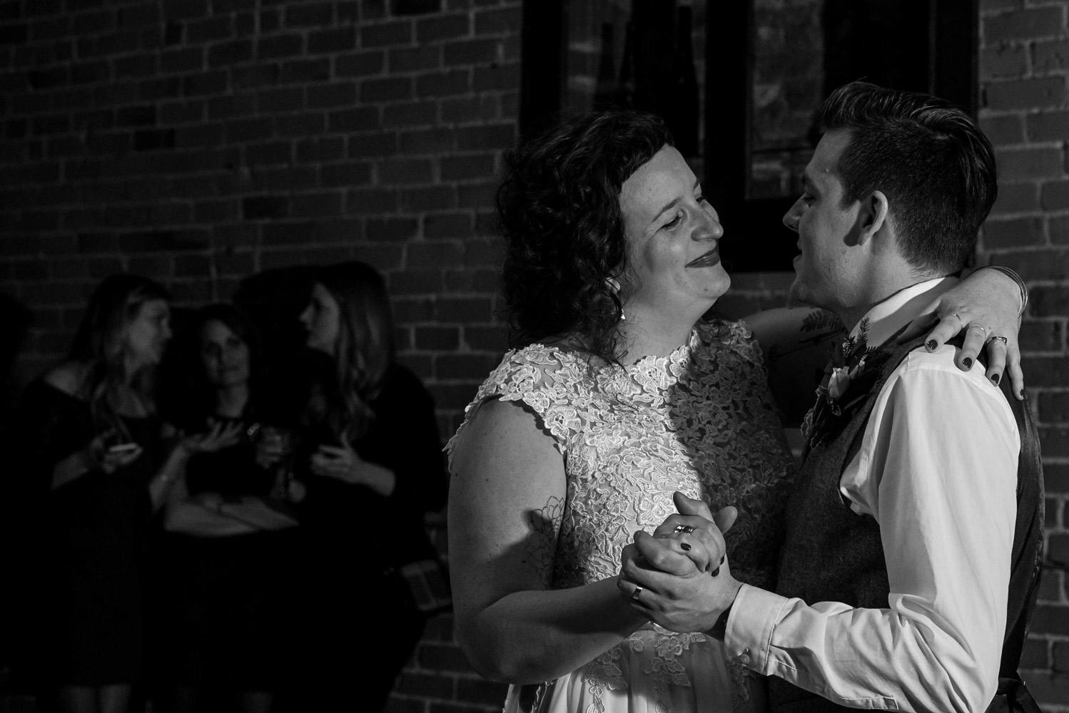 bride smiling at the groom during their first dance at Turtle's 