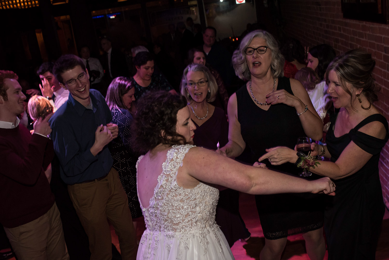 bride dancing with the guests during the reception at Turtle's